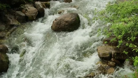 Powerful stream movement in mountains, close-up. Stock Footage 306674755