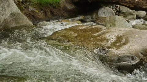 Powerful stream movement in mountains, close-up. Stock Footage 307902002