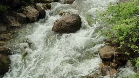 Powerful stream movement in mountains, close-up. Stock Footage 309618044