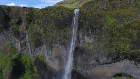 A powerful stream of water falls from a high cliff. Andreev. Video stock 78119064