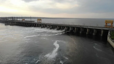 Powerful stream of water falls from the shutter in the dam, hydroelectric Stock Footage 107877443