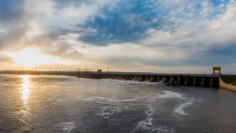 Powerful stream of water falls from the shutter in the dam, hydroelectric Stock Photos