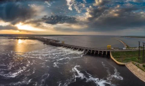Powerful stream of water falls from the shutter in the dam, hydroelectric Stock Photos