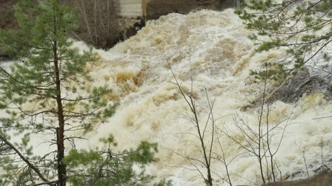 A powerful stream of water flowing over the rocks. Slow motion video. Stockbeeldmateriaal 190603454