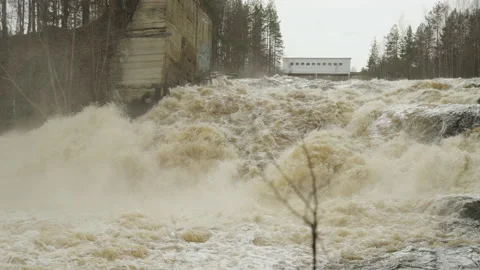 A powerful stream of water flowing over the rocks. Slow motion video. Stockbeeldmateriaal 194361059