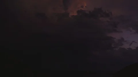 Powerful thunderstorm over the sea with continuous flashes of lightning. Video stock 128730387