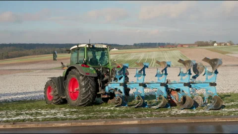 Powerful Tractor Plowing Field in 4K – Agricultural Machinery in Action Stock Footage 305188102