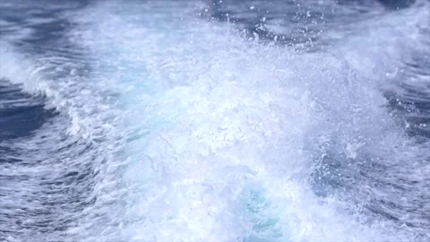 Powerful wake and large ocean waves generated by a fast boat sailing Stock Footage 341269164