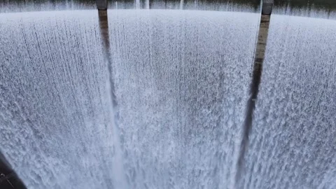 Powerful Water Cascade Through Concrete Spillway Stockbeeldmateriaal 334043806
