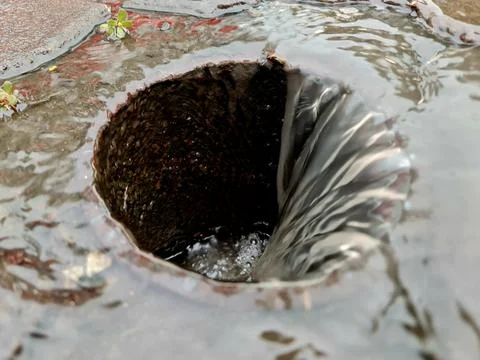 Powerful Water Drain Vortex During Heavy Rainfall Urban Drainage System Fotos de archivo