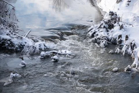 Powerful water flow in the river, winter time Fotos Stock