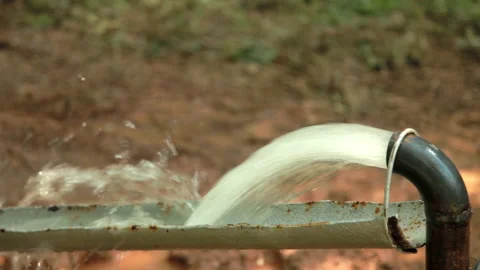 Powerful Water Flowing from a Pipe Pump. Stock Footage 132261624