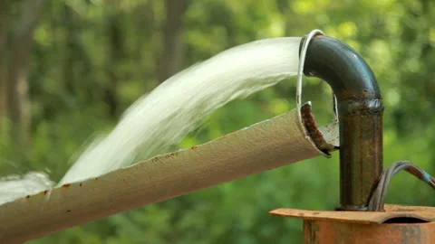 Powerful Water Flowing from a Pipe Pump. Stock Footage 132643512
