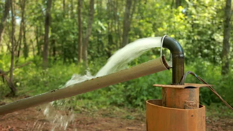 Powerful Water Flowing from a Pipe Pump. Stock Footage 133122359