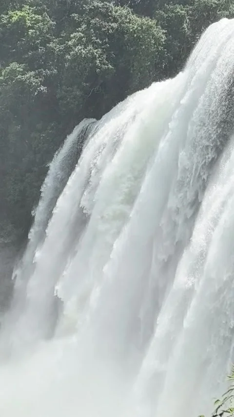 Powerful Waterfall Cascade Surrounded by Green Forest Vertical Stock-Footage 344093985