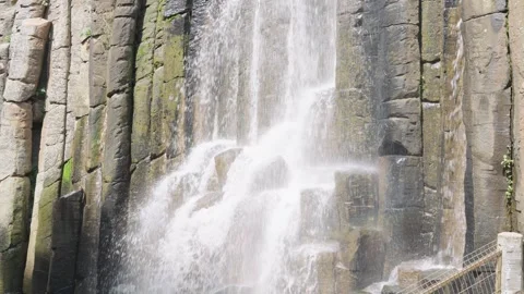 Powerful waterfall cascading down the impressive basaltic prism rock formations 動画素材 342041787