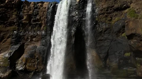 Powerful Waterfall Cascading Down Rocky Cliff, Natural Pool, Tilt Down Shot Stock-Footage 324771274