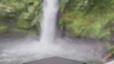 Powerful Waterfall Cascading in Lush Green Rainforest, Vertical Reveal 스톡 동영상 324496664