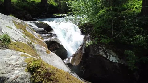 Powerful Waterfall Cascading Over Mossy Rocks in the Serene Austrian Alps i.. Stock Footage 337042205