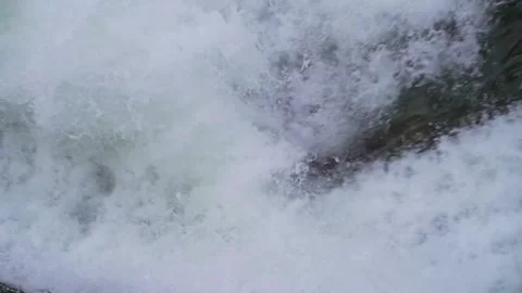 Powerful Waterfall Cascading Over Rocks in a Lush Forest Setting Stock Footage 342004330