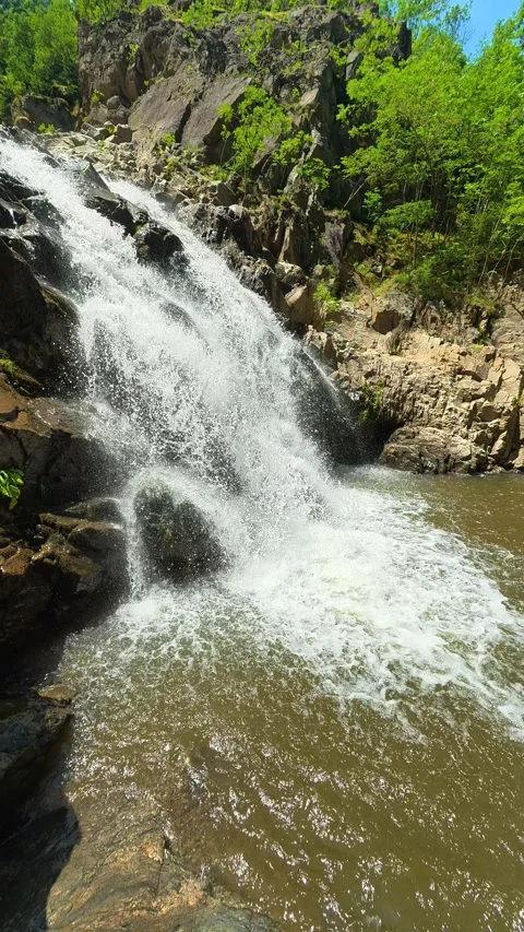 Powerful waterfall crashes down rugged rocks. Vucjanka Canyon, Serbia. Vertical Stock Footage 341130413