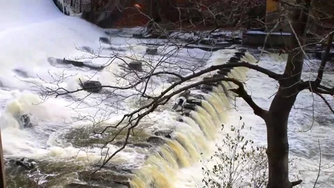 Powerful Waterfall Creates Waves in Water Stock Footage 222496549