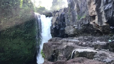 Powerful waterfall falling from cliff with mist tropical nature landscape Bali 스톡 동영상 332692685