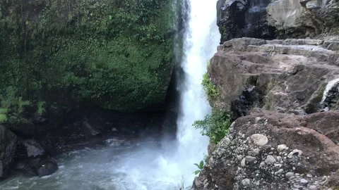 Powerful waterfall falling from cliff with mist tropical nature landscape Bali 스톡 동영상 332692701