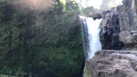 Powerful waterfall falling from cliff with mist tropical nature landscape Bali 스톡 동영상 332692705