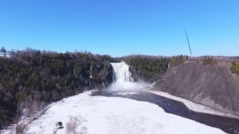 Powerful waterfall flowing over cliff in canadian landscape aerial Stock Footage 333216199