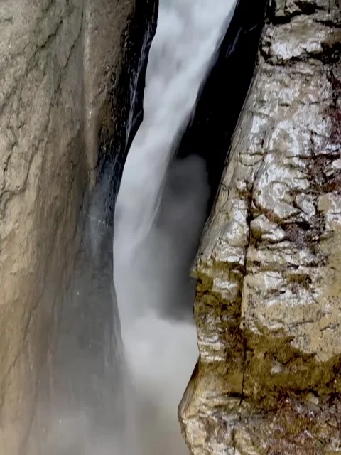 Powerful Waterfall Flowing Through Narrow Gorge Stock Footage 340870786