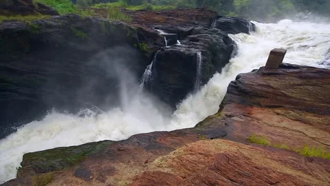 Powerful Waterfall Flowing in Uganda 4k Stock Video Stock Footage 338263929