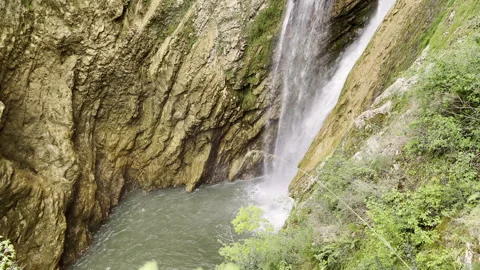 Powerful waterfall in the forest, water stream falling down into the wild source Stock Footage 317766769