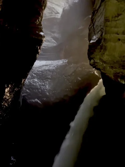 Powerful Waterfall Inside Dark Rock Gorge Video stock 340870742