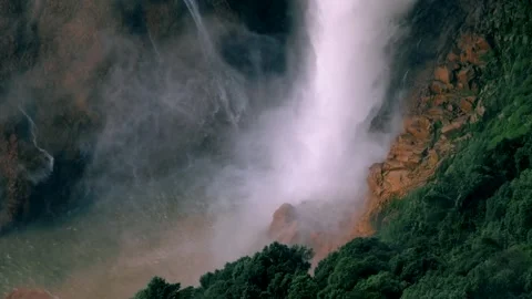 Powerful Waterfall Mist and Spray at the Base of a High Cliff, Cascading Wa.. Video stock 341111939