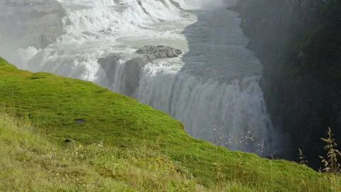 Powerful waterfall plunging into deep canyon Stock Footage 318968756
