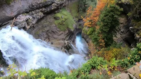Powerful Waterfall Plunging into Turquoise Canyon Pool in Autumn Stock Footage 344033167