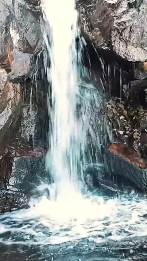 Powerful Waterfall Roar Blended with Subtle Splashing and Surrounding Ripples Stock Footage 274687574