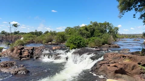 Powerful waterfalls and river rapids flowing over brown rocks Stock Footage 337060445