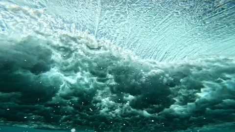 Powerful wave breaks underwater turbulence, strong wave crashing, clouds. Stock Footage 284895822