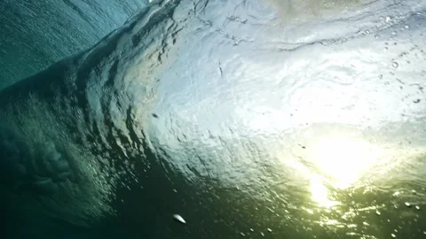 Powerful wave breaks underwater turbulence, strong wave crashing, clouds. Stock Footage 284896577