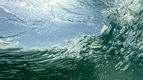 Powerful wave breaks underwater turbulence, strong wave crashing, clouds. 스톡 동영상 284896947