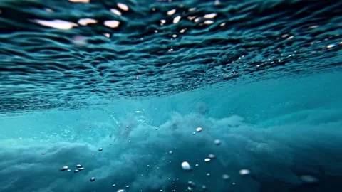 Powerful wave breaks underwater turbulence, strong wave crashing, clouds. Video stock 284897356