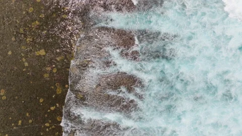 Powerful Wave Crashes Over Coral Reef Spreading Foam, Top Down Ascend Stock Footage 299285901
