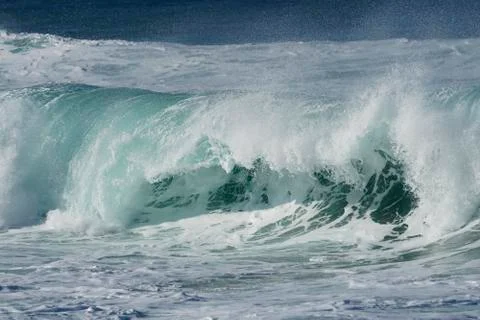 Powerful wave rolling Stock Photos