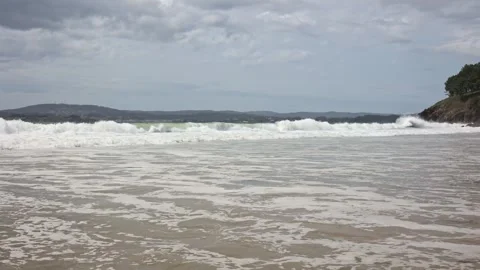 Powerful Waves and Dramatic Skies: A Scenic Ocean Encounter Stock Footage 246238355