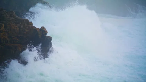 Powerful waves breaking cliff making explosion. Closeup dramatic ocean washing Stock Footage 237612407
