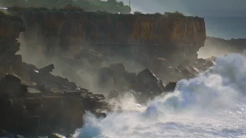 Powerful waves breaking cliffs making explosion splashing in super slow motion. Stock Footage 237559722