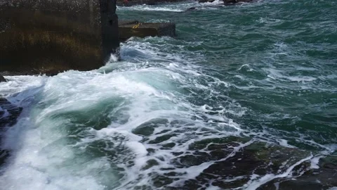 Powerful waves breaking at seawall in major severe storm Stock Footage 165814996