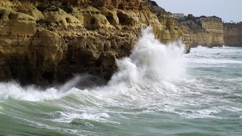 Powerful waves at cliffs, half speed motion Stock Footage